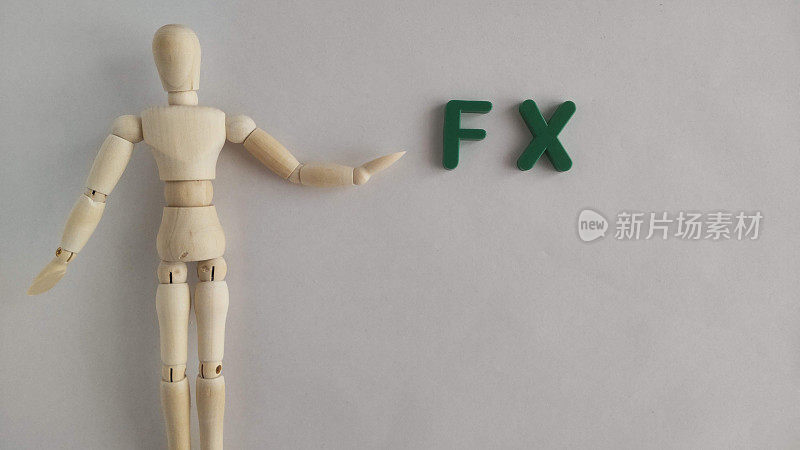 带有FX(外汇)标志或标志的人体模型的照片材料。