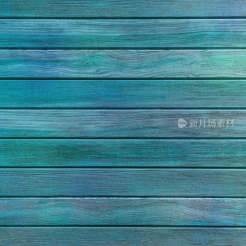 由风化和磨损的木板组成的蓝色木板背景。