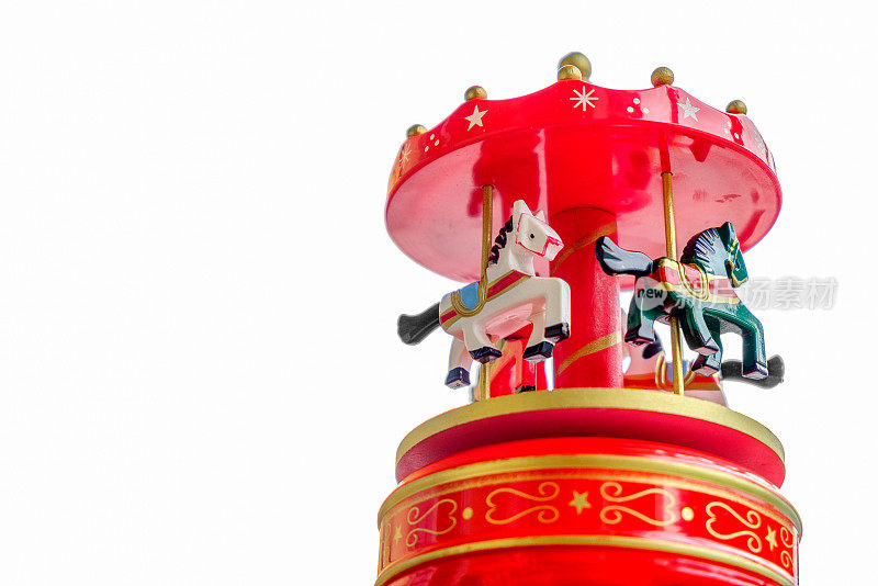 音乐盒红色旋转木马旋转木马的马玩具特写白色背景