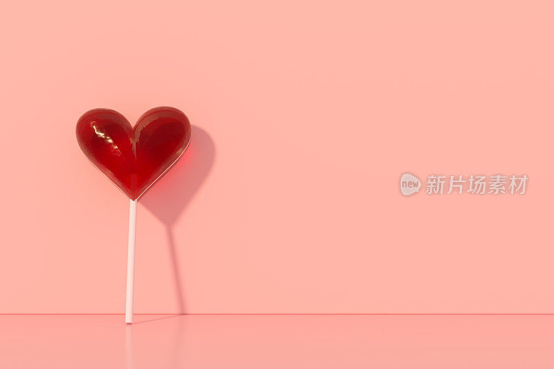 情人节，粉色背景上的心形棒棒糖
