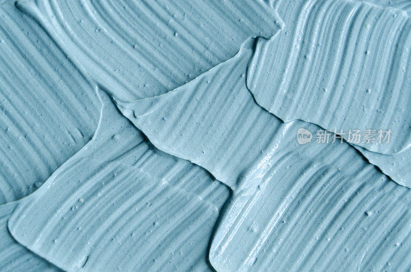 蓝色寒武纪化妆粘土(面膜、霜)质地特写，选择性聚焦。抽象的背景。