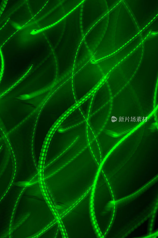 带运动模糊效果的抽象散焦灯光背景(绿色)