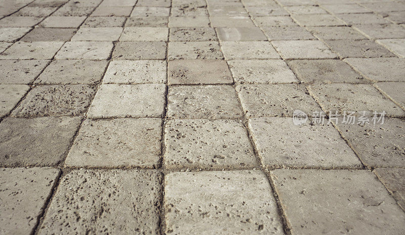 砖路面。街道道路地面上单调的灰色石头透视图。人行道，车道，铺路机，人行道在复古设计地板的方形图案纹理背景