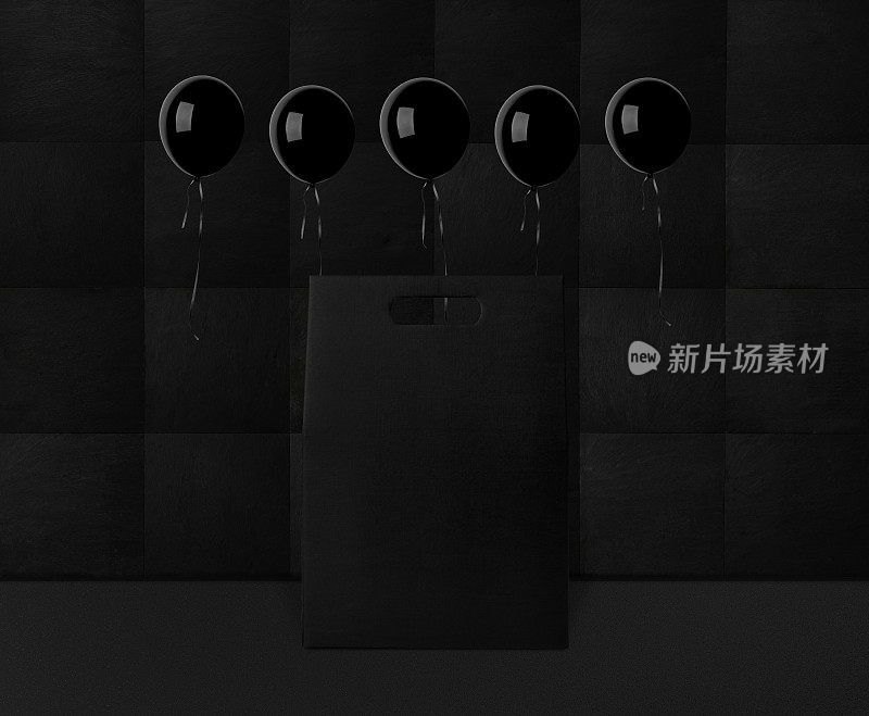 空白的黑色礼品盒，气球漂浮在半空中。黑色星期五