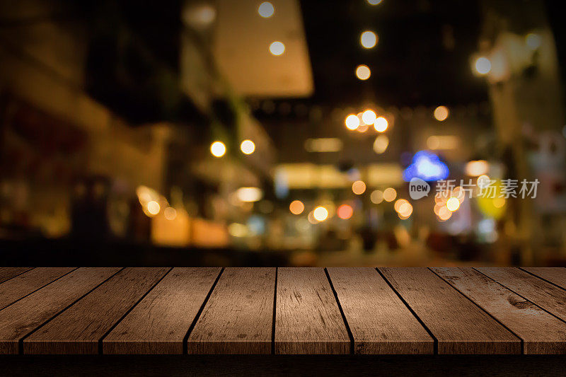 用抽象的散景灯光背景模糊咖啡店或咖啡厅餐厅。用于创建蒙太奇产品显示