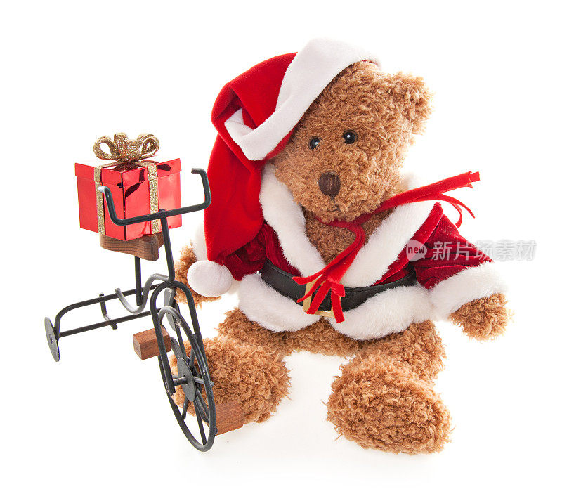 泰迪熊圣诞老人与圣诞礼物和玩具自行车