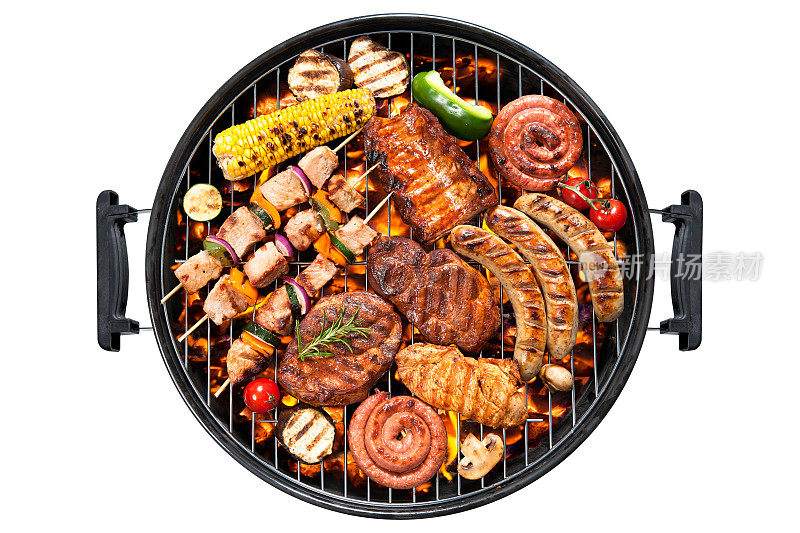 在圆形烤架上概述各种肉类和蔬菜