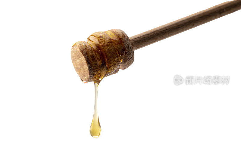蜂蜜从木蜂蜜勺上滴下来