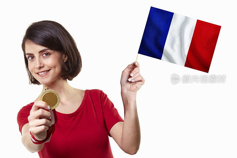 年轻的女孩拿着金牌和法国国旗