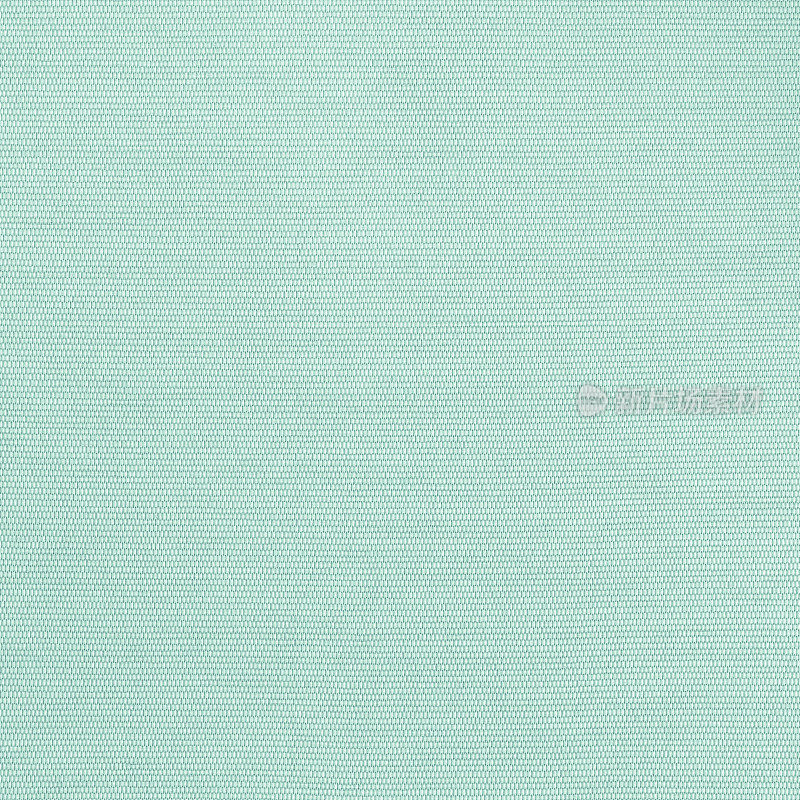 棉麻织物纺织编织纹理的背景，在柔和的浅绿色蓝色薄荷色