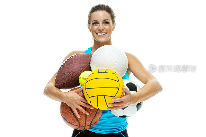 兴高采烈的女运动员拿着运动球