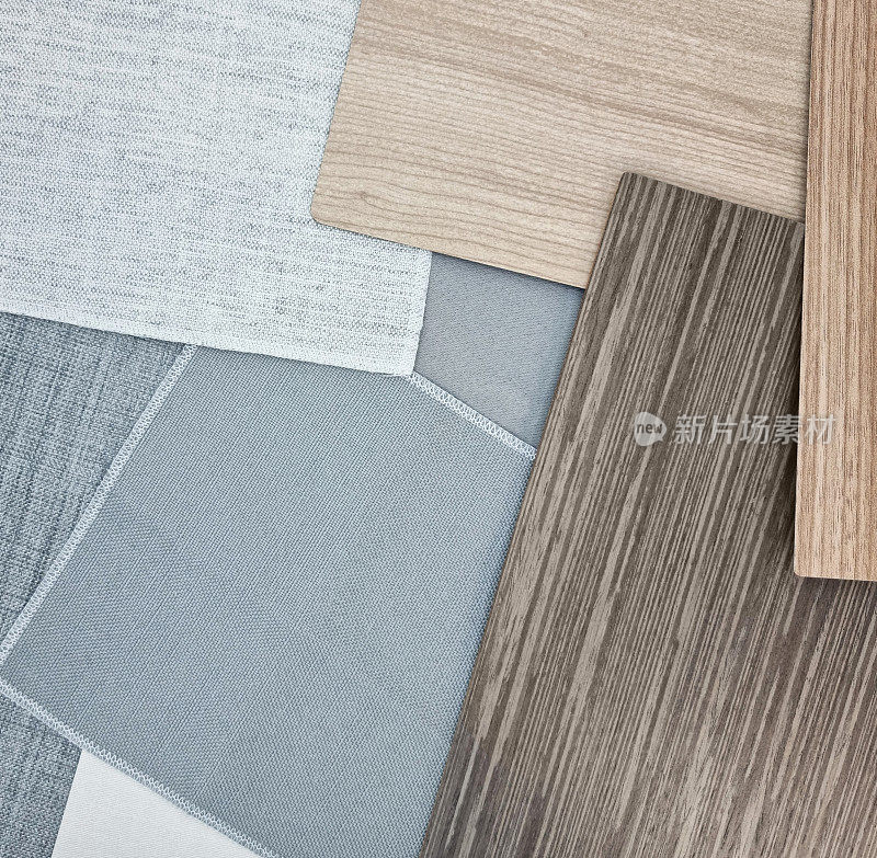 背景，灰色布料样品的组合，意大利胡桃木贴面，橡木层压供选择。斯堪的纳维亚室内风格的室内材料样品。