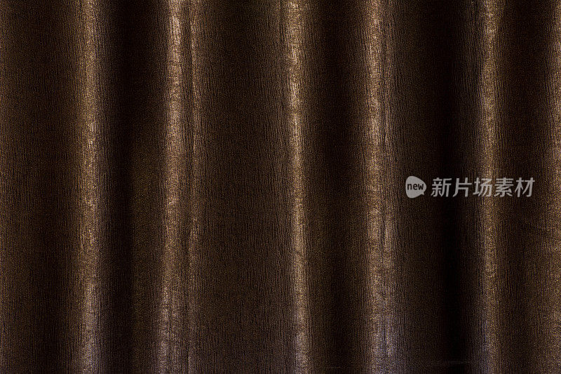 深色的棕色窗帘纹理背景。