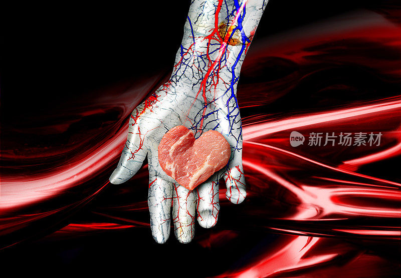心形的人造肉被放置在金属机器人的手掌上。背景是红色的血管。
