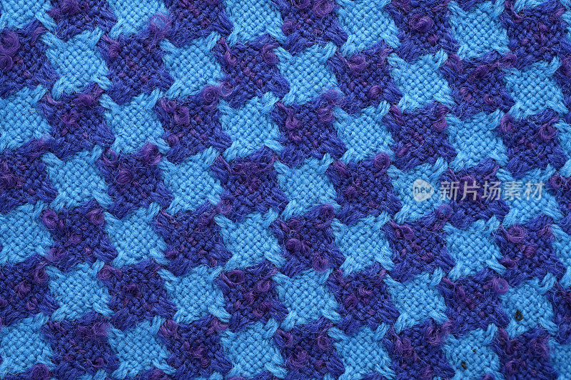 蓝色和紫色的羊毛粗花呢织物质地