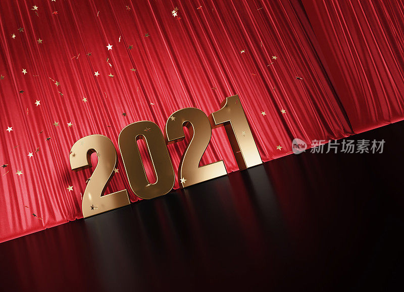 2021年概念-金色2021坐在红色窗帘下的星星形状的五彩纸屑