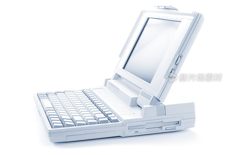 侧视图的一个旧的白色笔记本电脑孤立