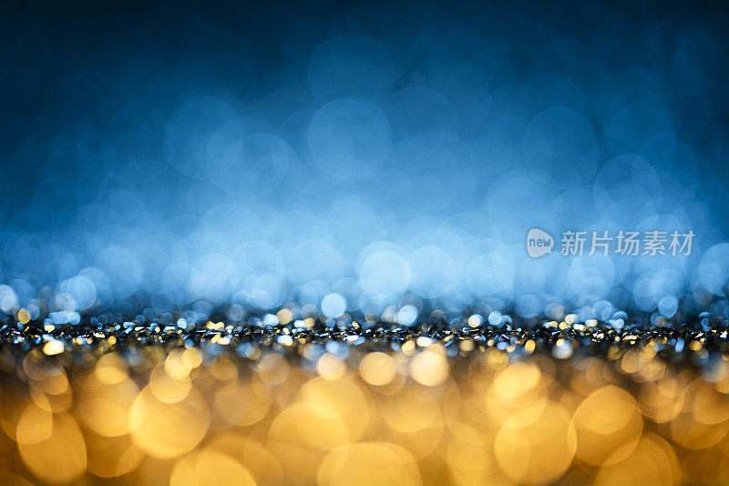 闪亮的灯散景-蓝色圣诞背景散焦抽象庆典