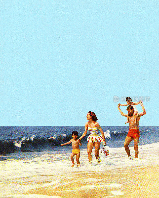 海洋海滩上的一家人