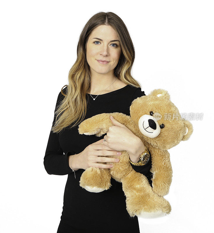 快乐的女人抱着白色背景的泰迪熊