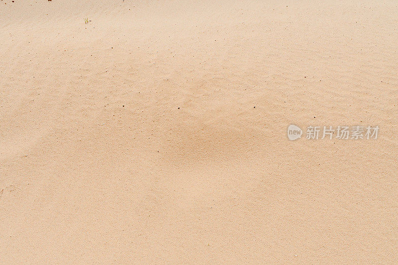 彩砂。棕色的沙子。背景来自细沙。沙背景