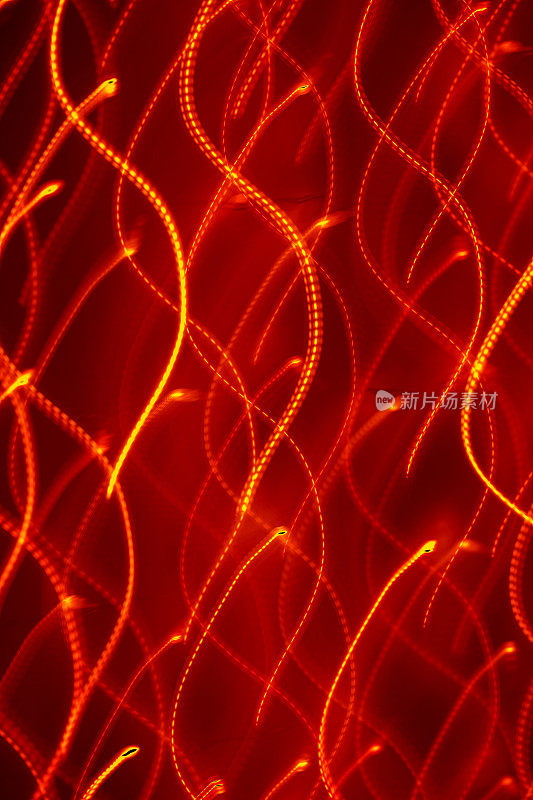 带有运动模糊效果的抽象散焦灯光背景(红色)