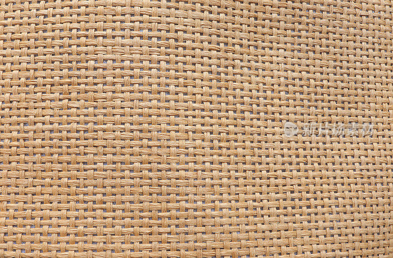 抽象的棕色草帽纹理。草帽的质地来自天然纤维。俯视图