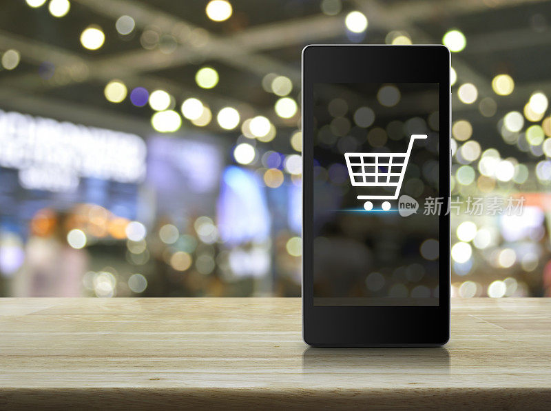 购物车图标在智能手机屏幕上模糊购物中心