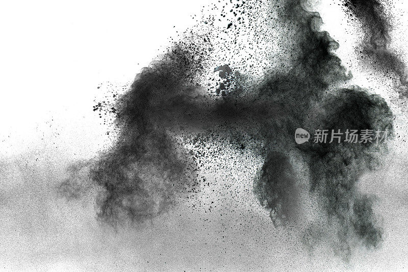 黑色的灰尘飞溅在白色的背景上