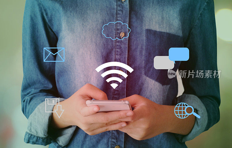 Wifi和数字网络数据图标在手使用智能手机背景，商业和技术的概念