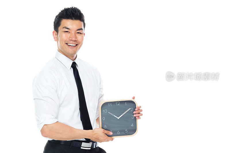 英俊的亚洲商人-拿着一个时钟