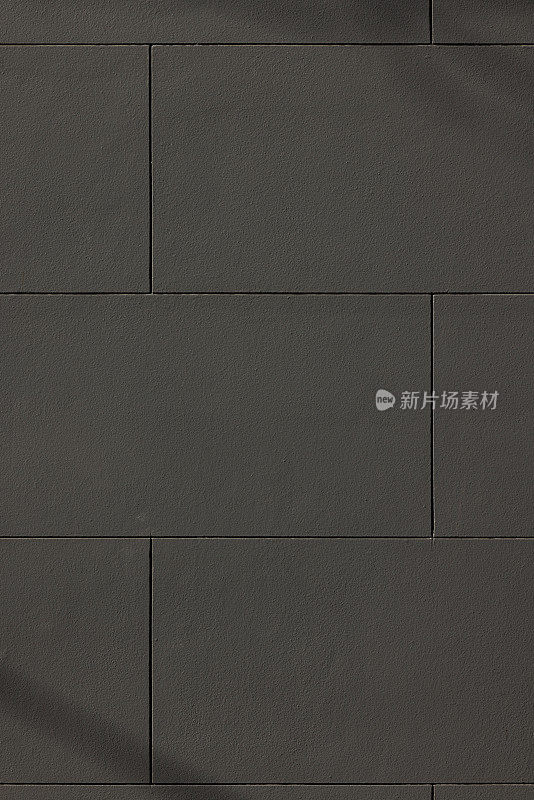 深灰色混凝土砌块墙的一部分