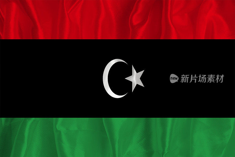 以丝绸为背景的利比亚国旗是一个伟大的国家象征。国家的官方国家象征