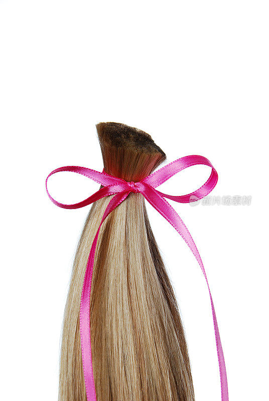乳腺癌捐赠金发马尾辫与粉红色蝴蝶结