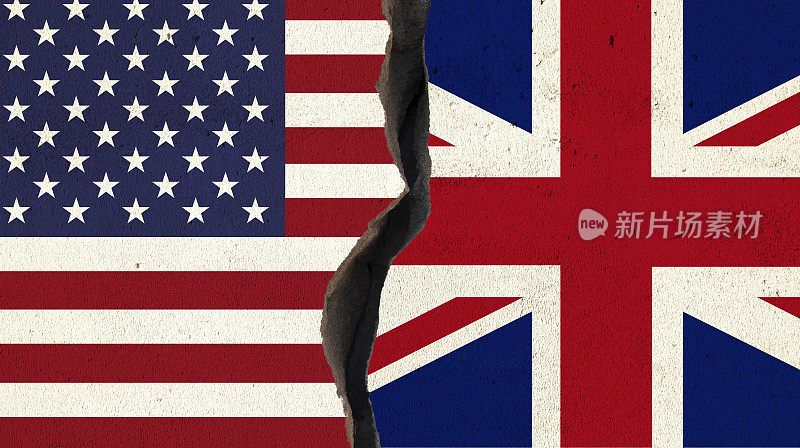 裂墙上的英美国旗对-冲突与分歧的概念