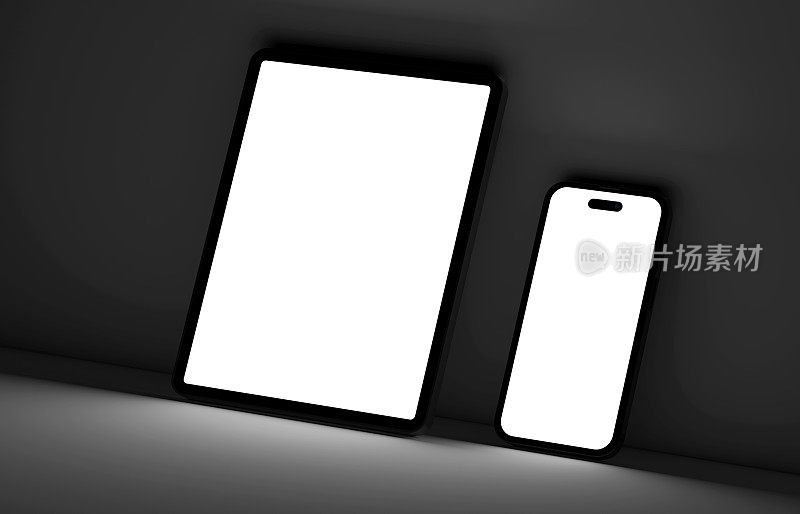 空白的智能手机和数字平板电脑，屏幕发出的光