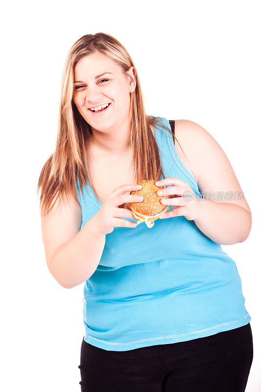 微笑胖女孩正要吃一个汉堡