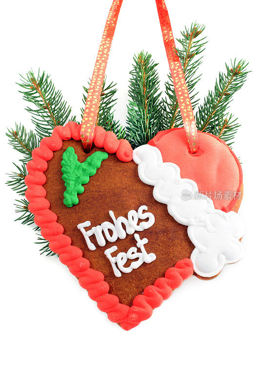 圣诞装饰姜饼心与德语单词frohes节