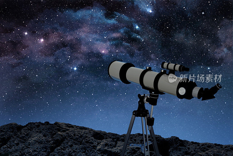 星空下岩石地面上的望远镜