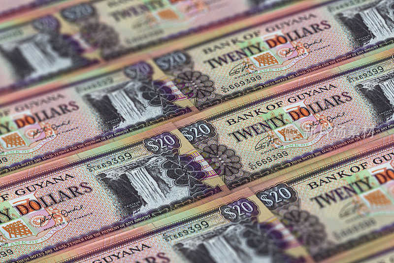 GYD。圭亚那货币背景。圭亚那美元钞票。乔治敦大学