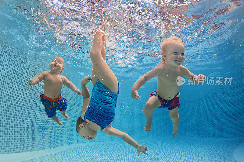 孩子们在游泳池里游泳和潜水，玩得很开心