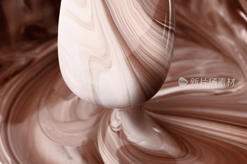 抽象的背景，热的，融化的巧克力和牛奶