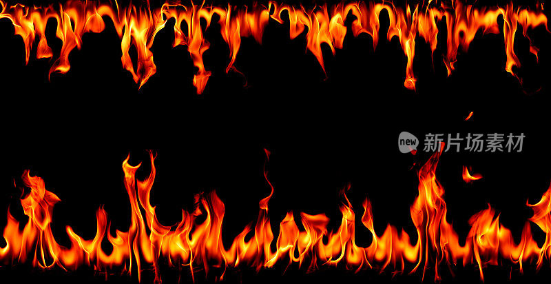 在黑色背景的火焰，燃烧的红色炽热的火花上升，炽热的橙色发光飞行粒子