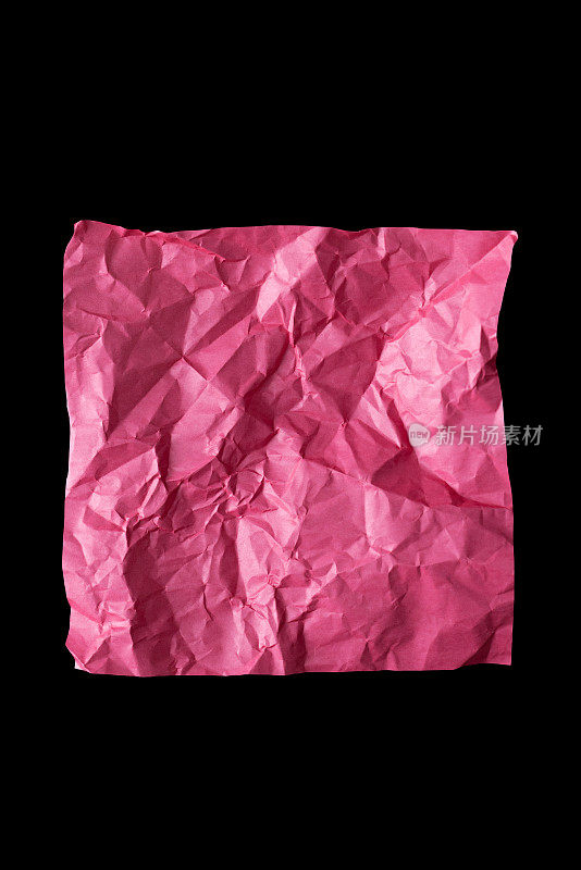 粉红色皱纸在黑色背景。纹理、背景