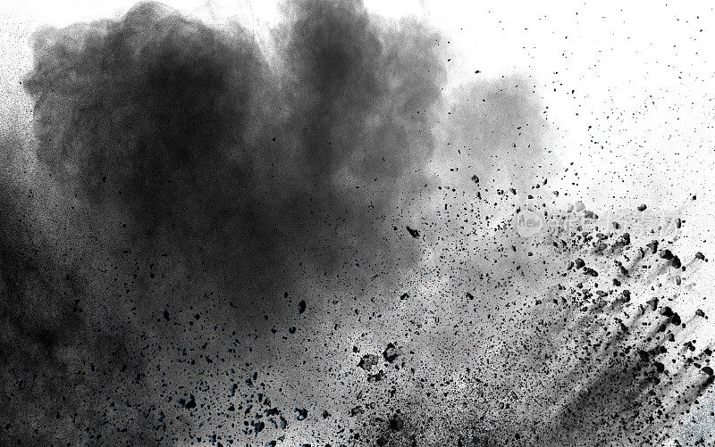 抽象的黑色粉尘爆炸在白色背景。