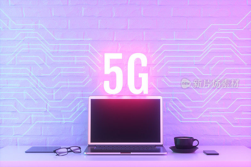 5G技术背景霓虹灯桌面与笔记本电脑