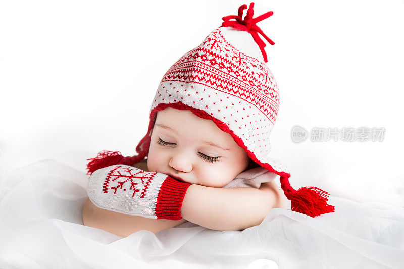 圣诞主题熟睡的婴儿在节日彩色配件-库存形象
