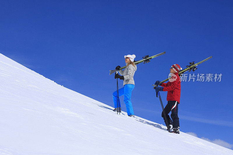 在雪上滑雪的男人和女人