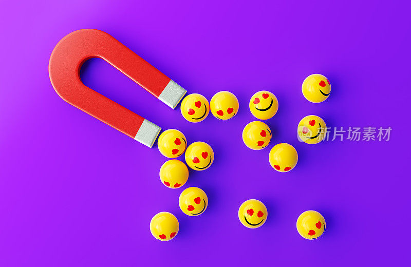 带有笑脸表情的黄色球体被紫色背景上的红色磁铁吸引