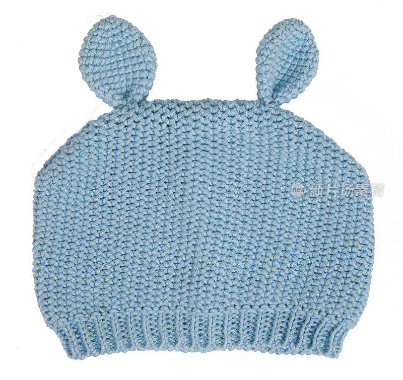 蓝色针织冬季羊毛帽子与绒球绒球的婴儿